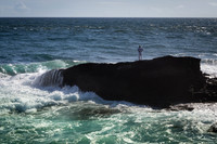 Man on rock Atlantic Ocean
