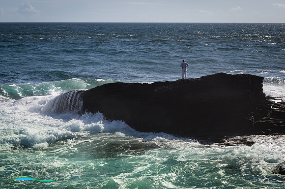 Man on rock Atlantic Ocean